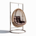 Hanging rattan chair with metal frame and cushion for indoor and outdoor use